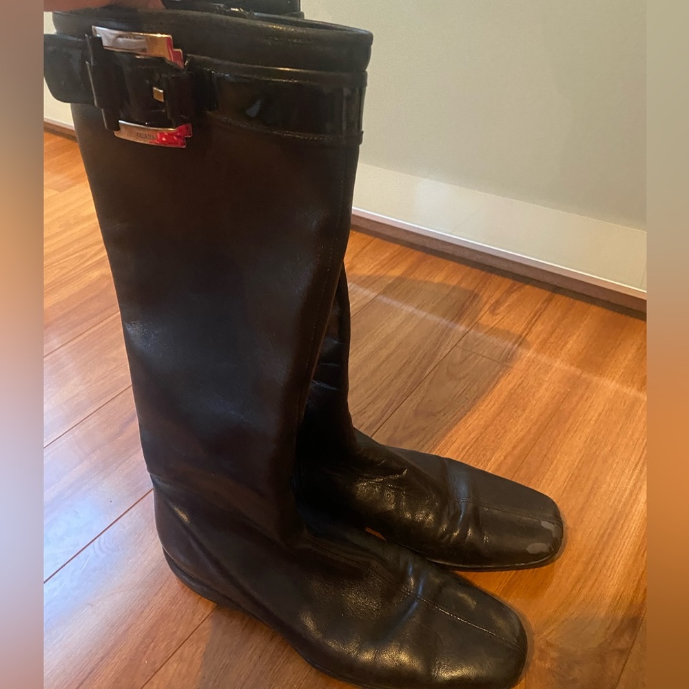 Black leather knee high Prada riding boots